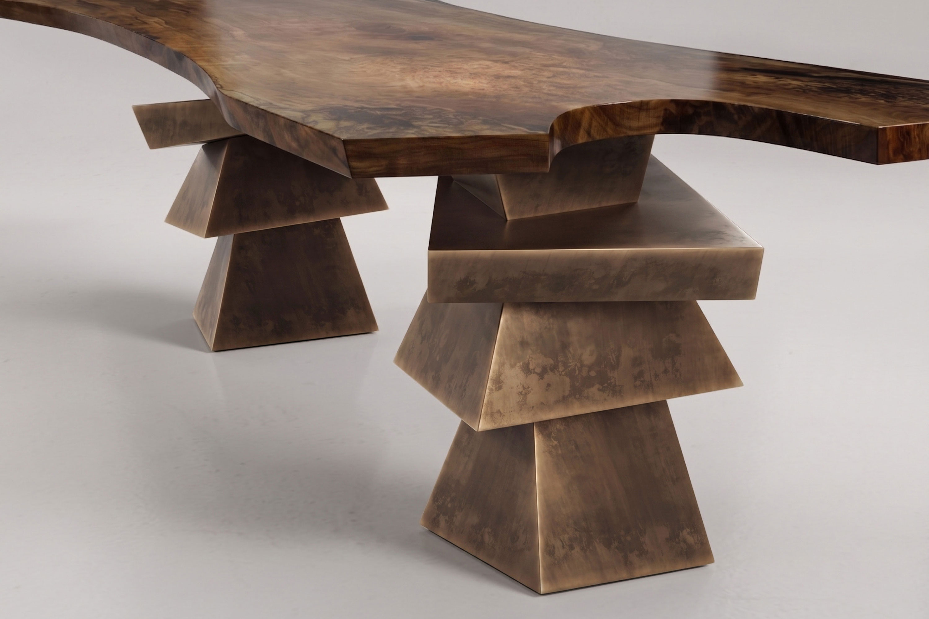 Close-up of the Roche dining table's stacked bronze base