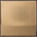 A warm, golden-toned finish defined by fine, directional brushstrokes that softly diffuse light. This elegant texture brings a refined, contemporary warmth to any setting.