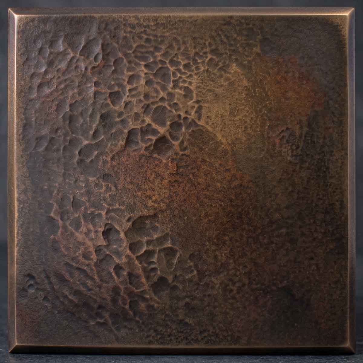 A rugged, highly textured finish that celebrates the raw, organic beauty of poured metal. Its deeply pitted surface creates stunning, tactile shadow play.