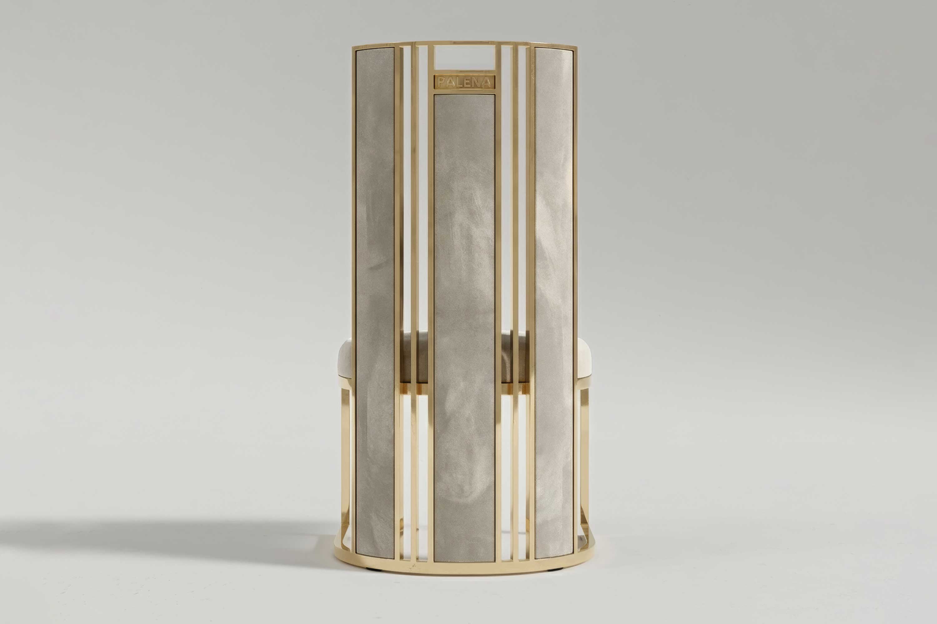 Colonna chair from behind, showing the fluted bronze column that forms the back.