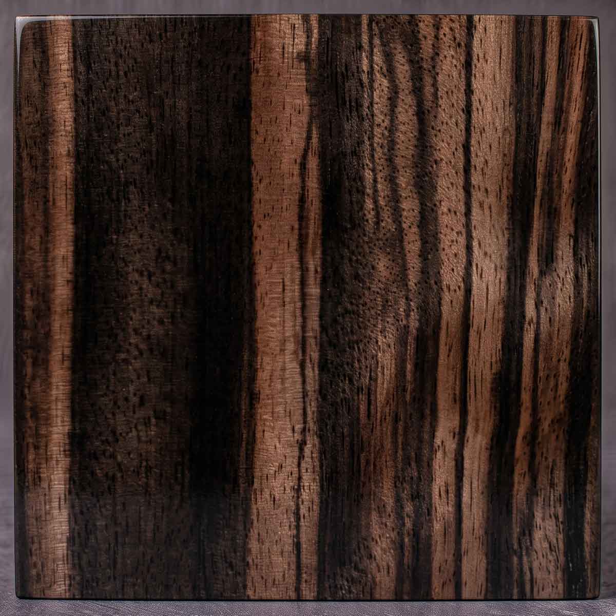 Features dramatic, high-contrast stripes of jet black and rich cocoa brown. An impactful, variegated exotic wood offering an intense, artistic appearance.