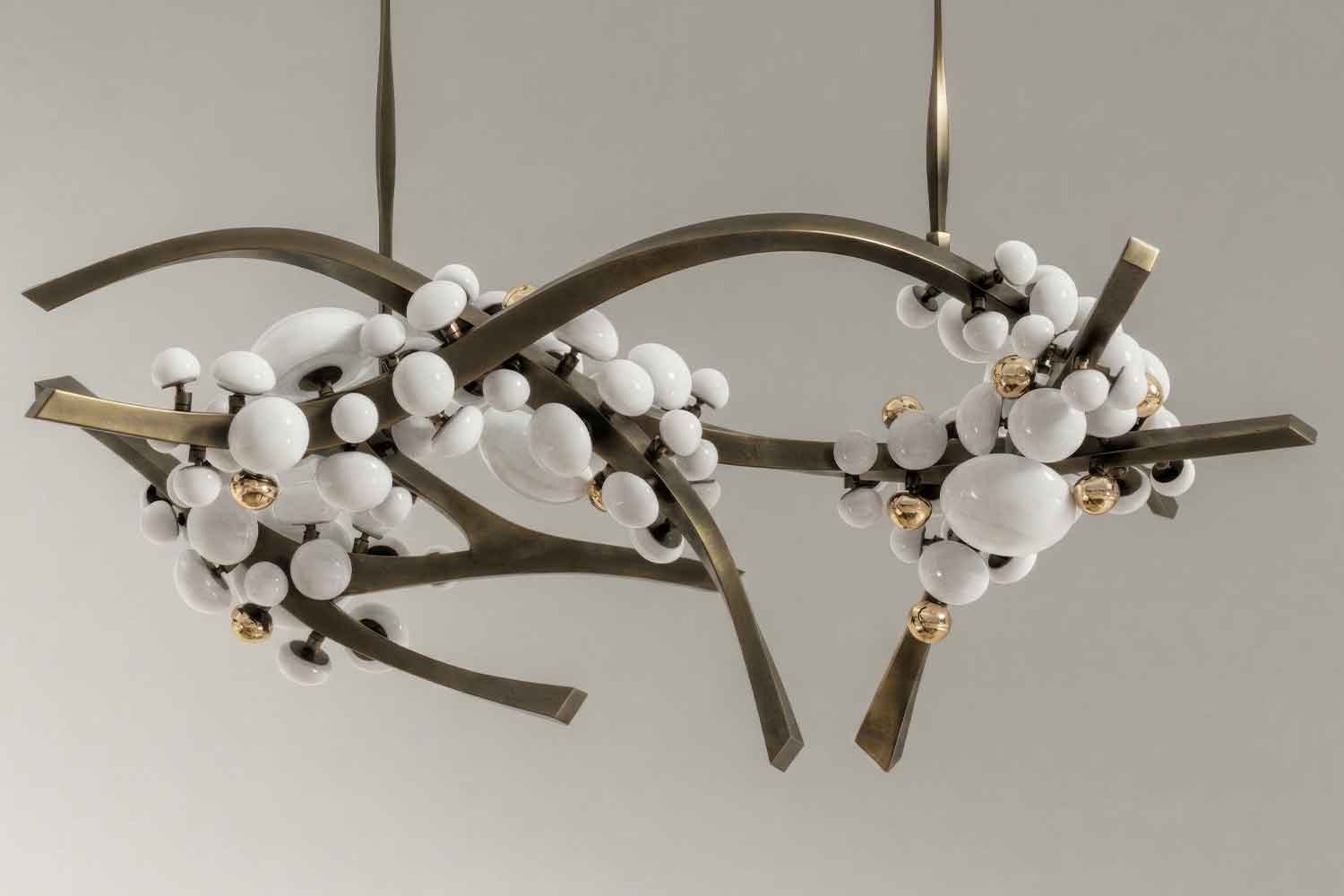 Close-up of the Intima chandelier's branching bronze frame