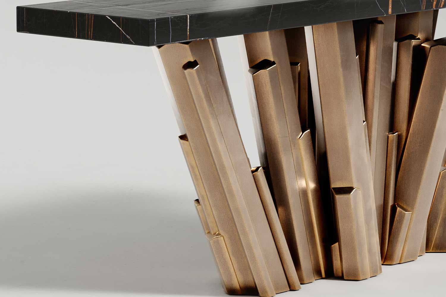 Close-up of the Meta Crystal table's faceted bronze base