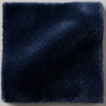 A decadent, high-pile silk velvet in a profound midnight navy. Its exceptionally soft hand and subtle sheen offer sophisticated depth and dramatic elegance.