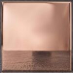 A brilliant, mirror-polished metal with elegant, blush-pink undertones. This striking finish brings a modern, romantic warmth to bespoke designs.