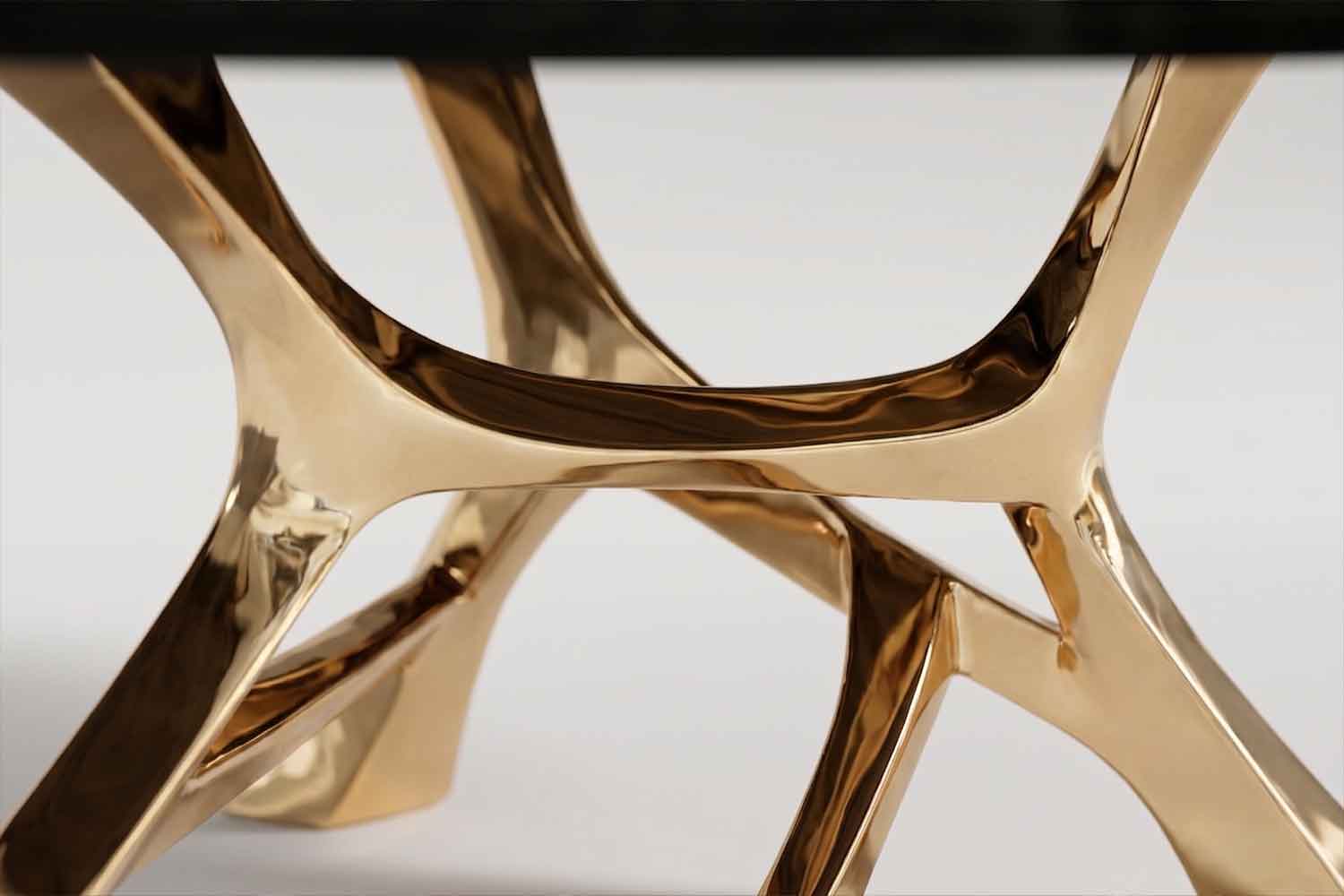 Close-up of the Vena dining table base showing its branching structural design