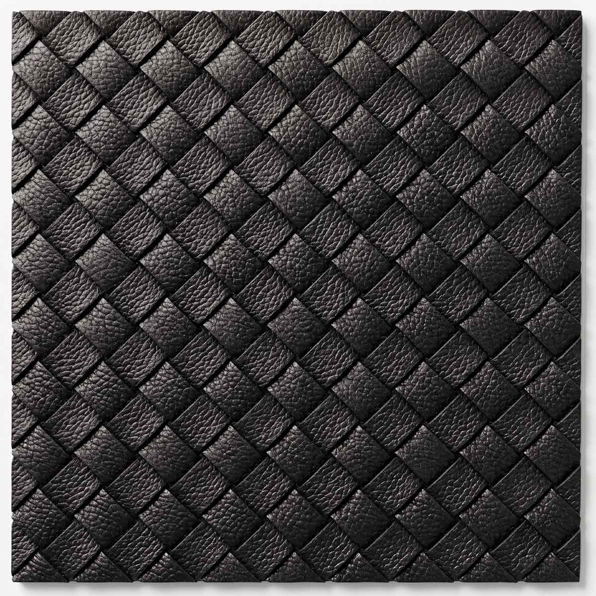 Hand-woven leather strips creating a sophisticated, architectural grid in deep black. Offers exceptional durability and striking geometric texture for statement pieces.