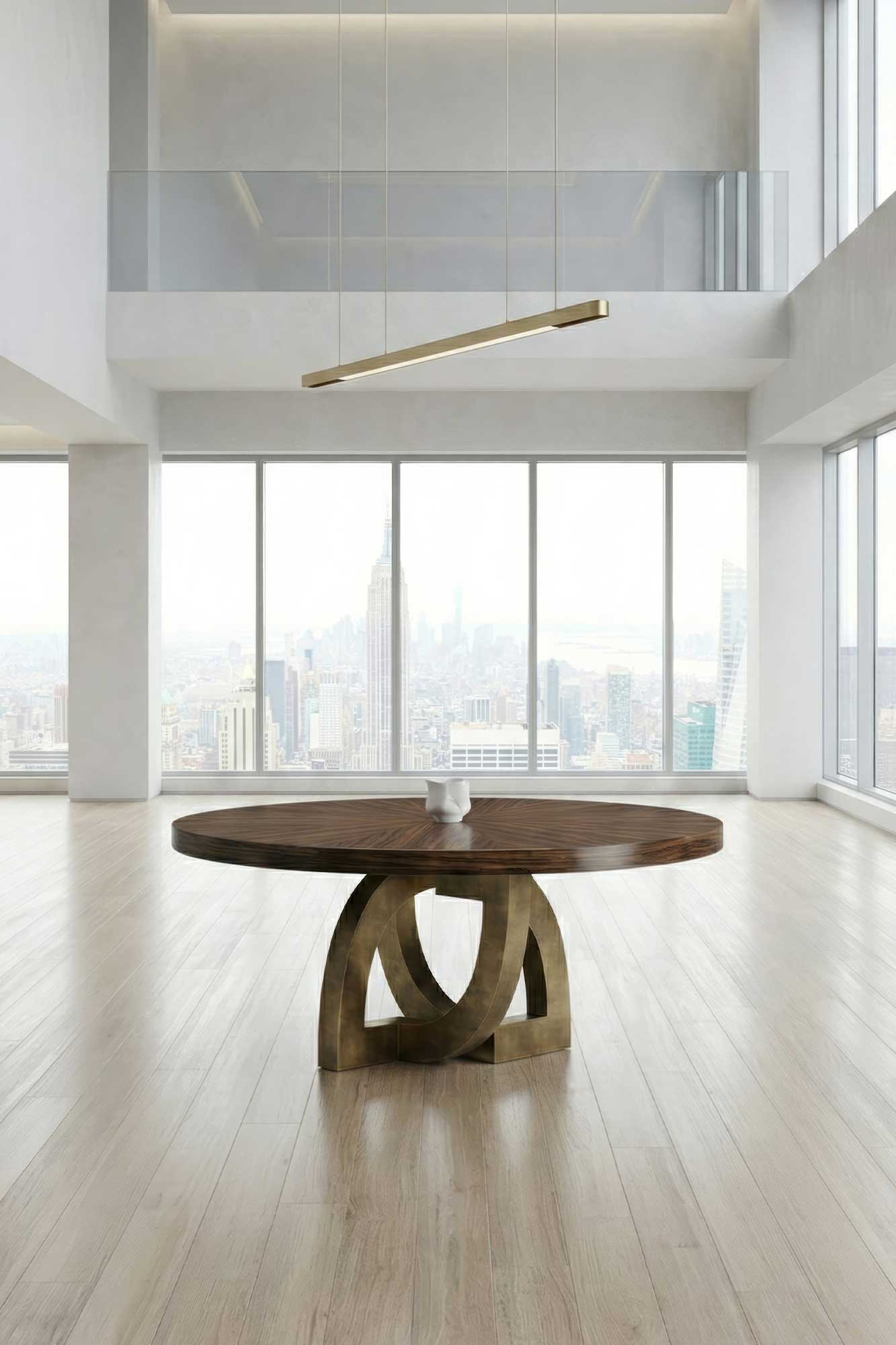 Arco Dining Table in patina bronze, sculptural arc-base dining table staged in a bright minimal interior with clean white walls, Palena Studio