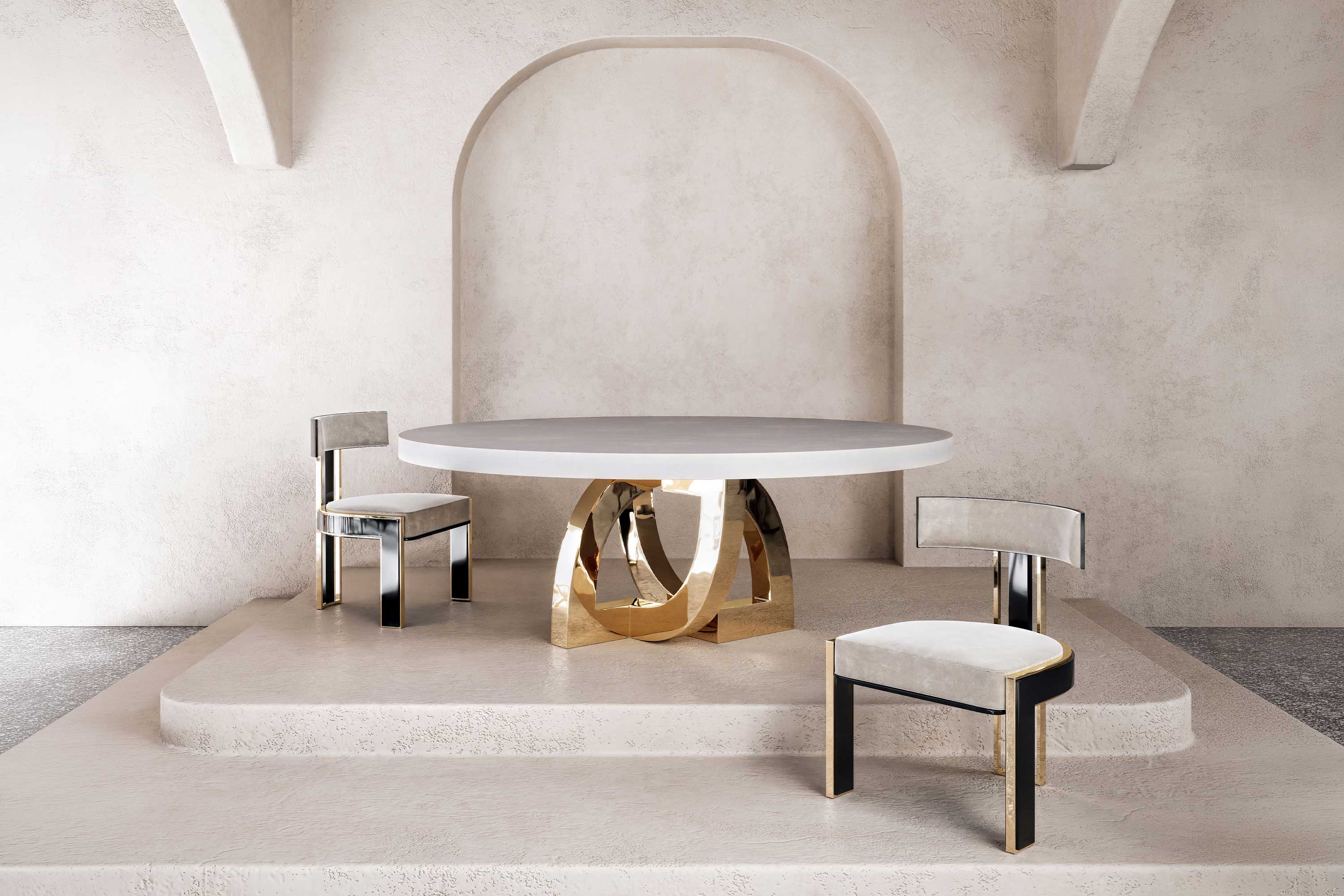 Arco Dining Table in polished bronze, sculptural arc-base dining table staged against a soft plaster wall with arched detail, Palena Studio