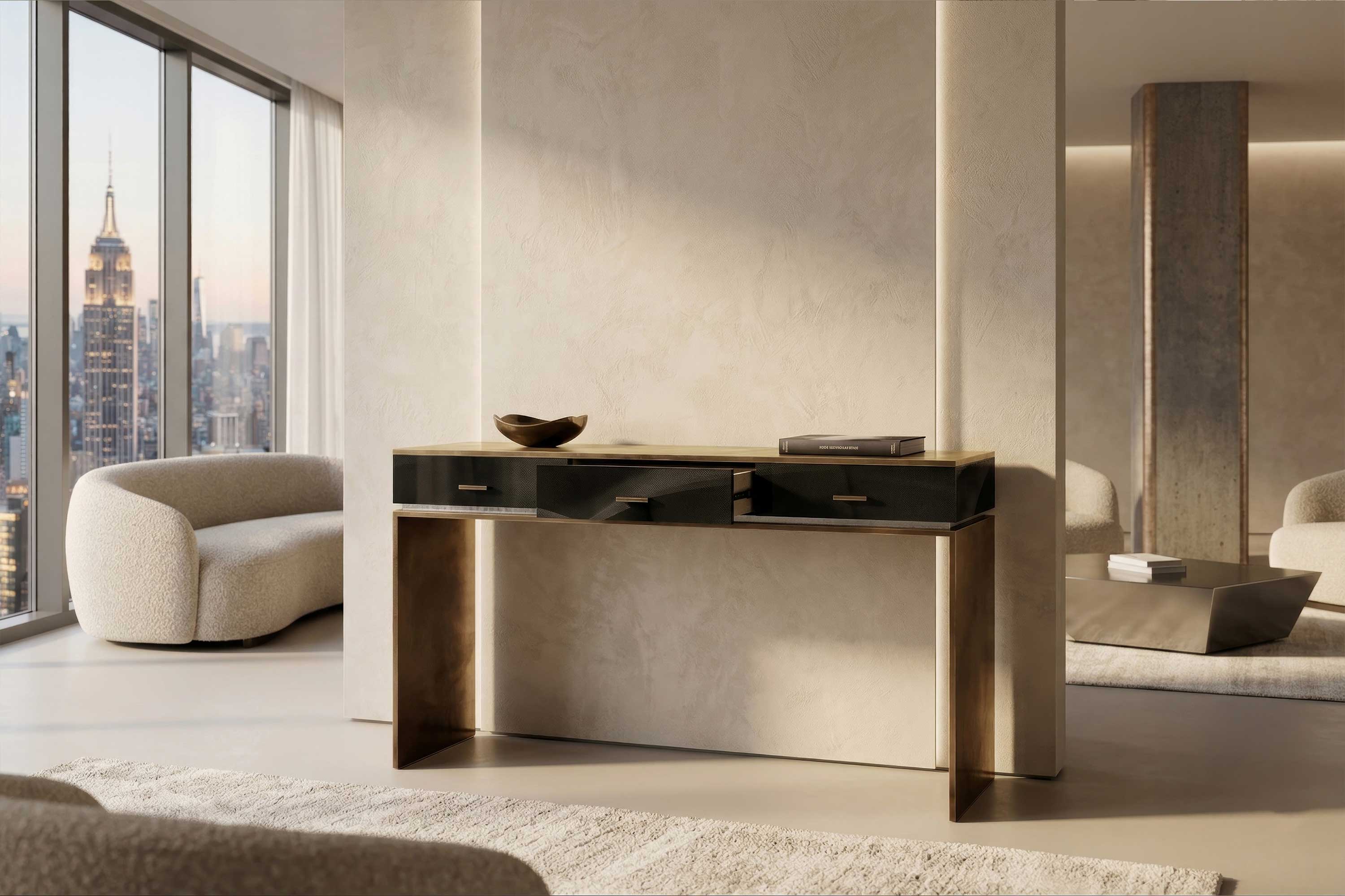 A modern living room with beige walls, a dark wood console table, two plush armchairs, a low coffee table, and floor-to-ceiling windows with a cityscape view, including the Empire State Building.