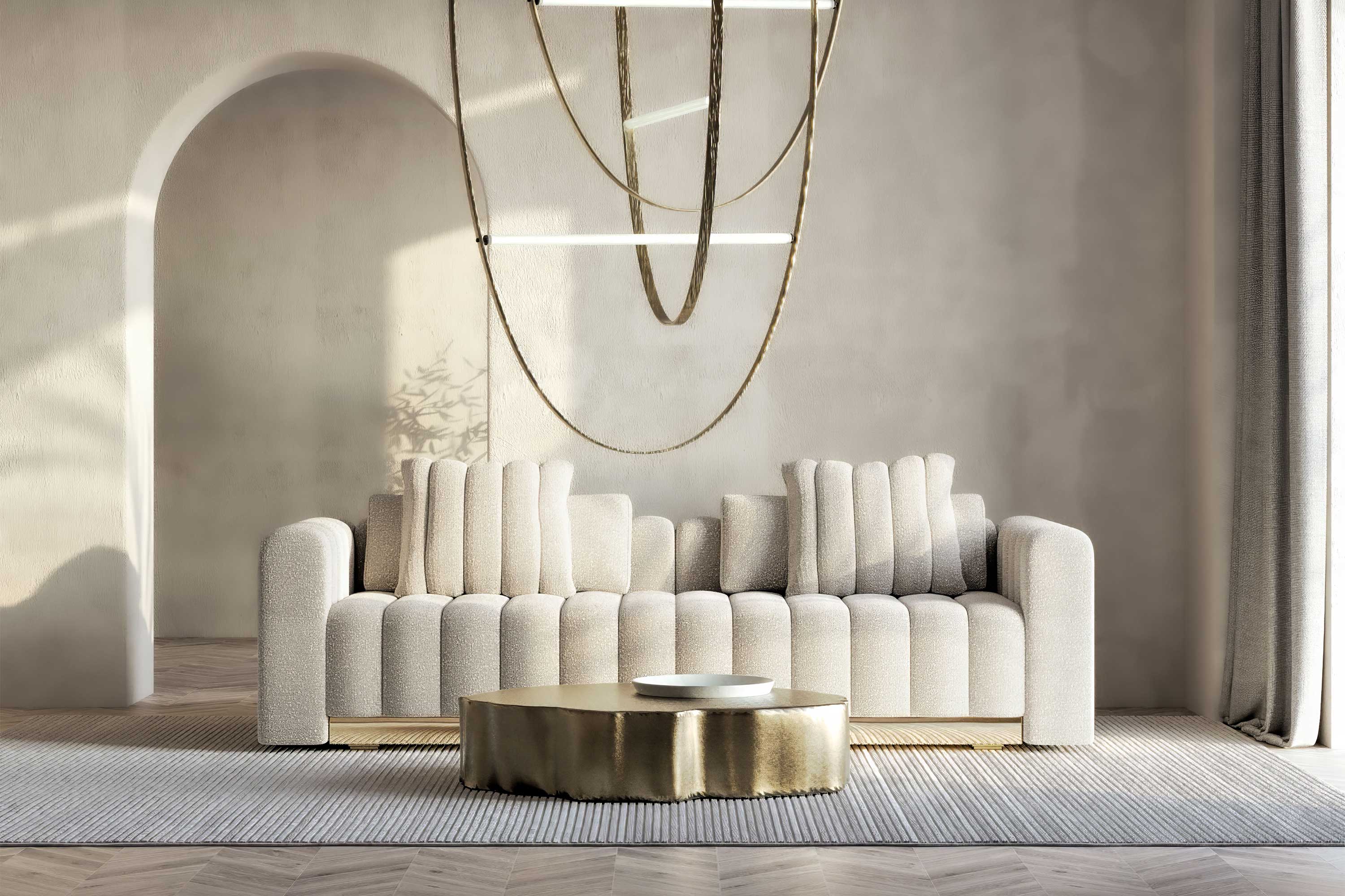 El-Mar Sofa in ivory upholstery, sculptural luxury sofa staged in a refined contemporary interior with gold pendant lighting — Palena Studio