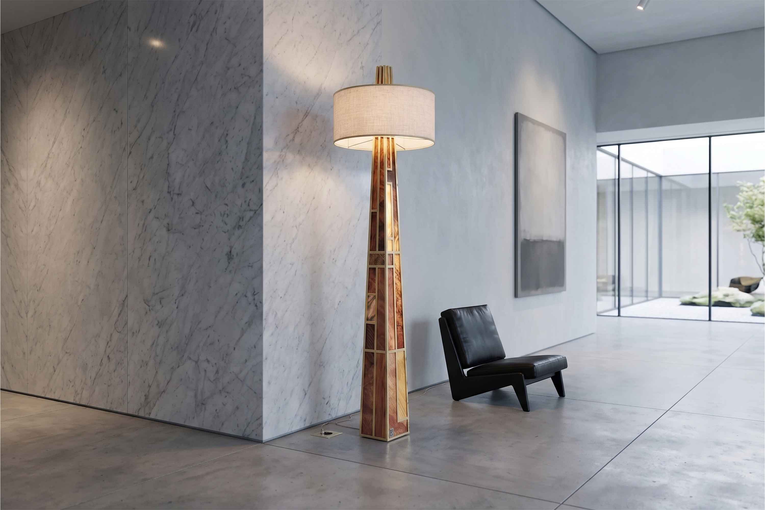 Emerald Floor Lamp in polished bronze with fabric drum shade, tall floor lamp staged against a warm dark editorial backdrop — Palena Studio