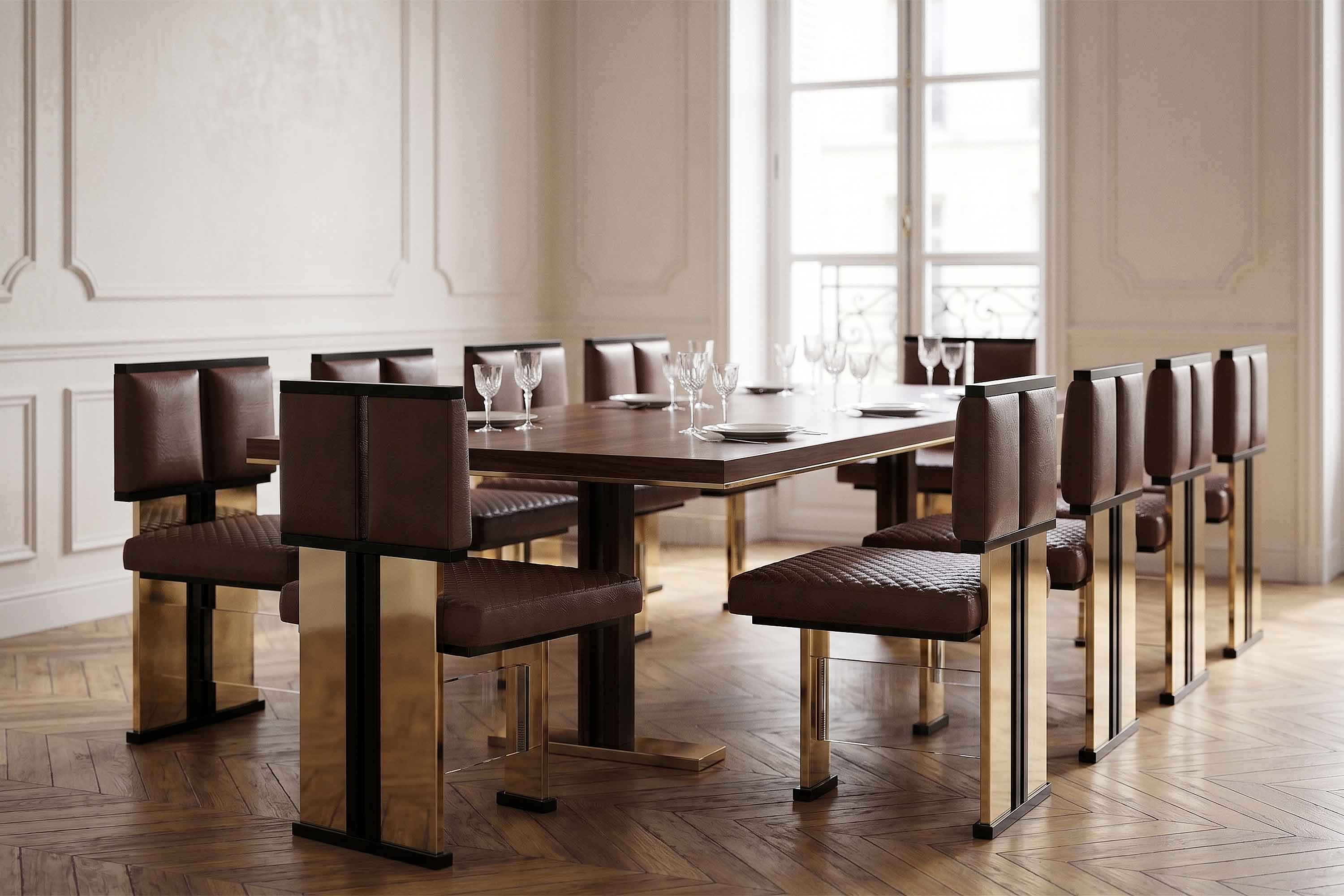 A modern dining room with a wooden table, eight brown leather and gold chairs, glassware, and plates set on the table. Large windows, light walls, and herringbone wood flooring are visible.