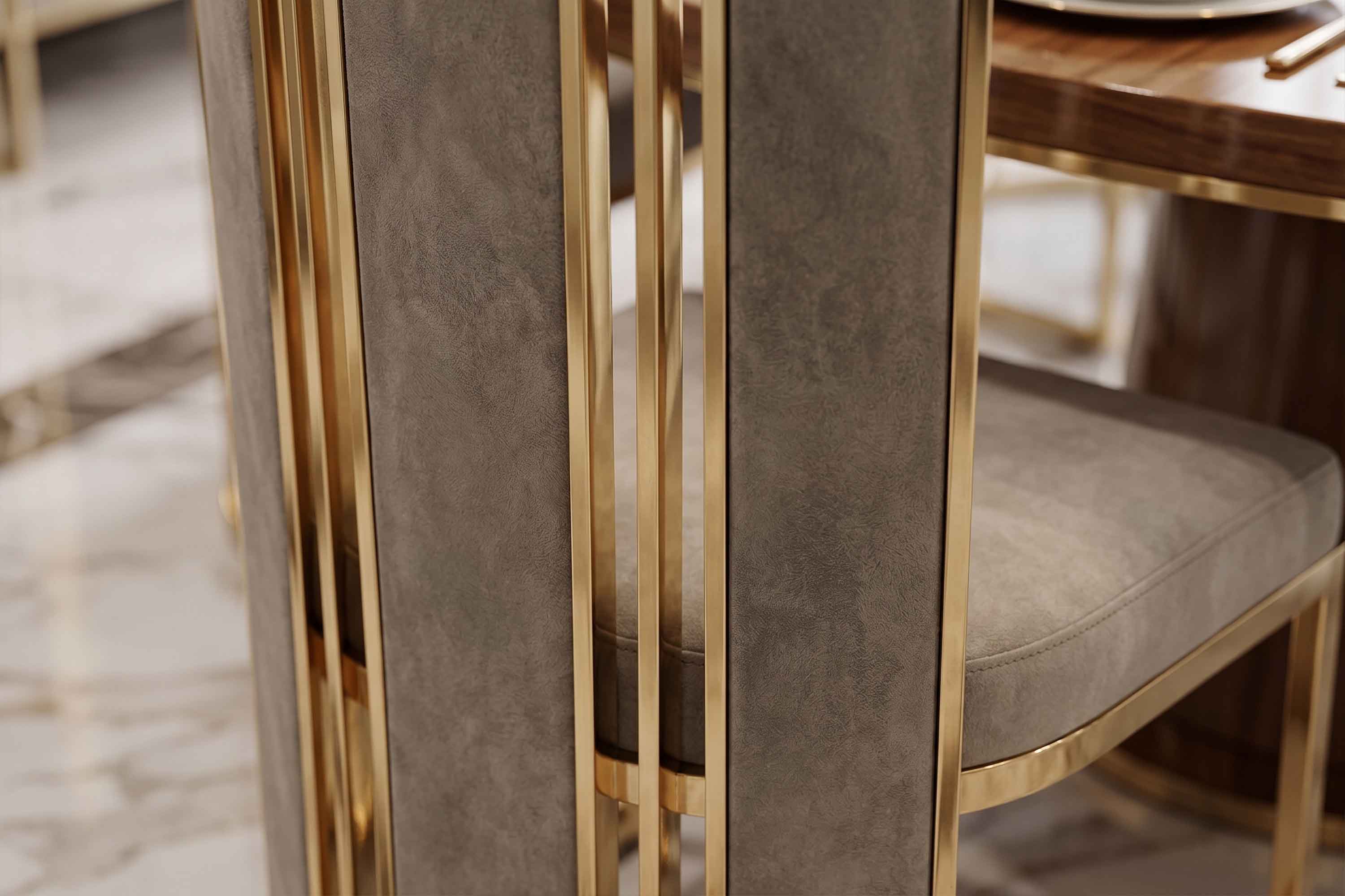 Close view of the Colonna chair, where the polished bronze flutes meet the mushroom velvet seat.