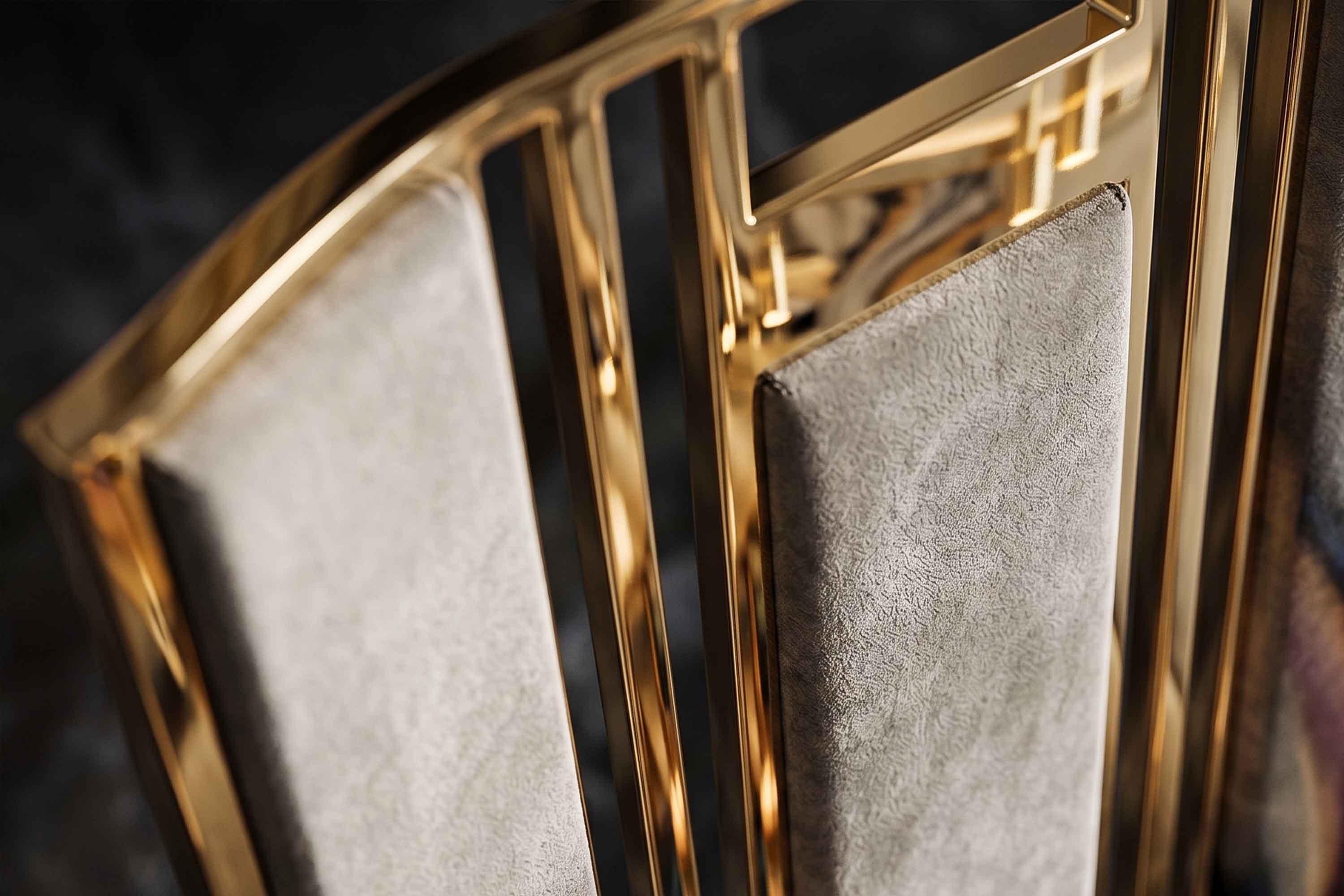 Detail of the Colonna chair's fluted polished bronze bands framing panels of mushroom velvet.