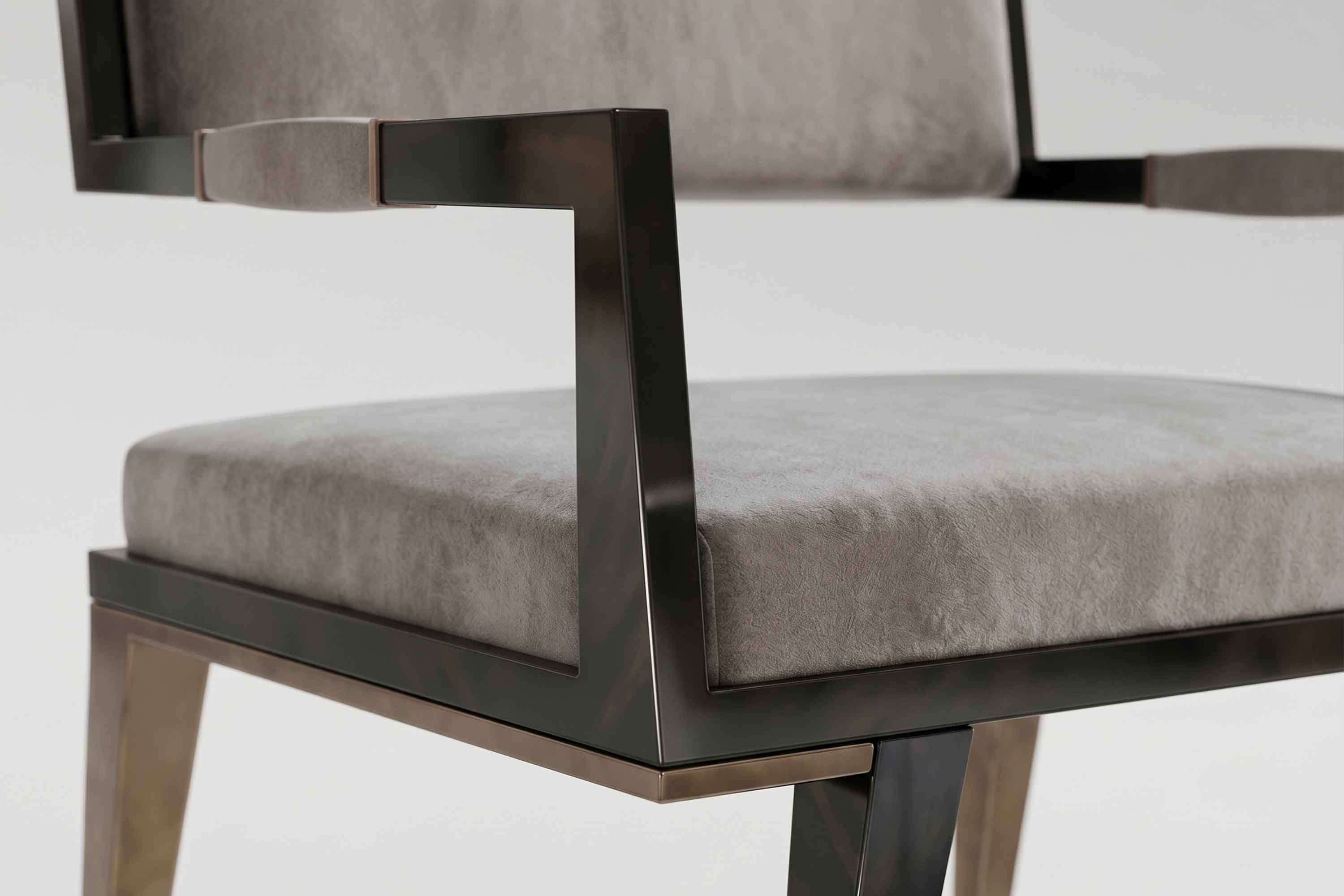 Detail of the Le Loup chair's lacquered arm and the champagne velvet seat beneath it.