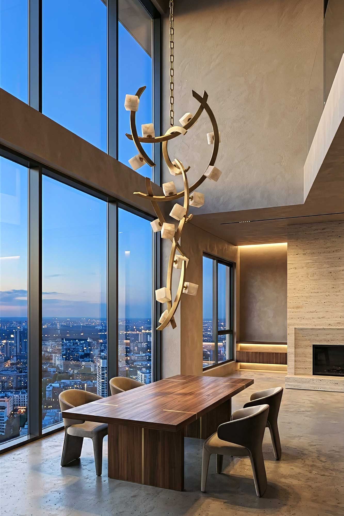 Cirro Vertical chandelier in patina bronze with ivory onyx cubes, cascading above a long wood table in a double height penthouse with skyline views — Palena Studio