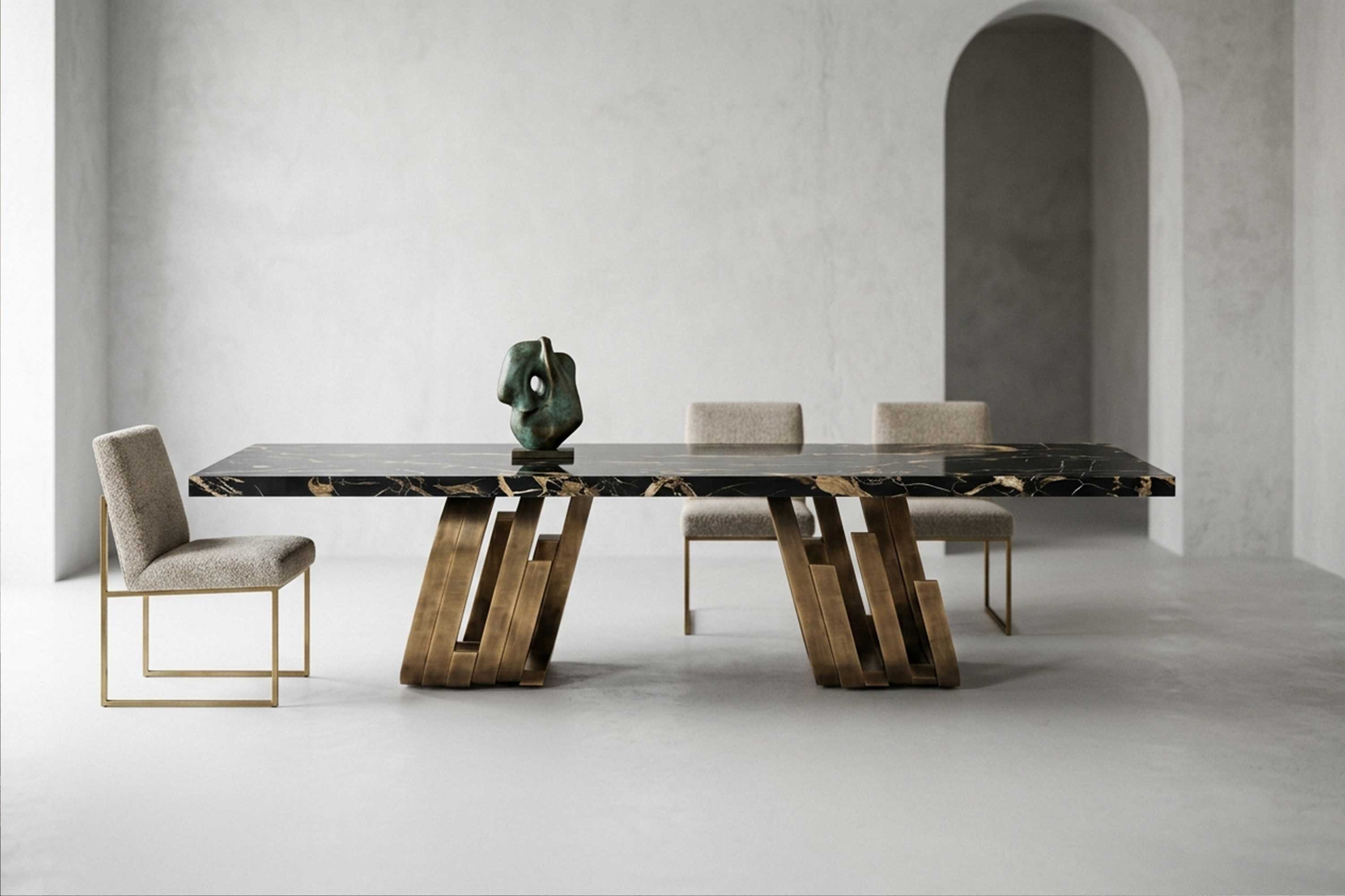 Oculus Dining Table in patina bronze with a Nero Portoro marble top, staged before an arched niche with a sculptural object on the table — Palena Studio